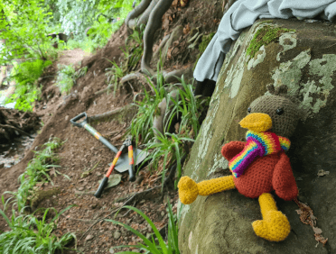 Croutons sits impatiently atop a rock at the work site, hoping the team get back to work asap.