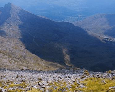 Views over extremely rocky terrain on the low slopes of the mountain.