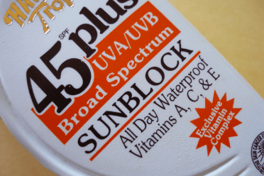 A close-up of a bottle of sunblock. It's SPF45 and includes UVA and UVB protection.