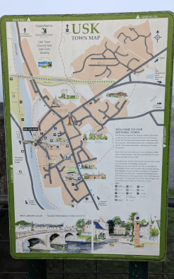 A photo of the Usk Town Map board, which displays the main routes through Usk.