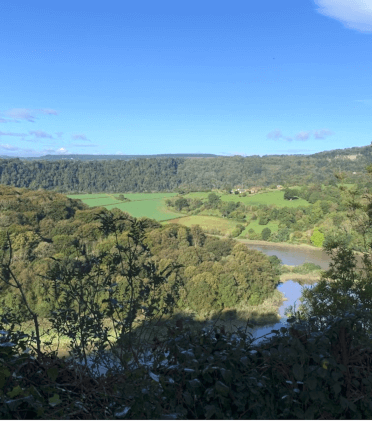 The Wye Valley Walk clambers up onto Offa's Dyke, offering views down over the leafy Wye Valley with the river at the bottom.